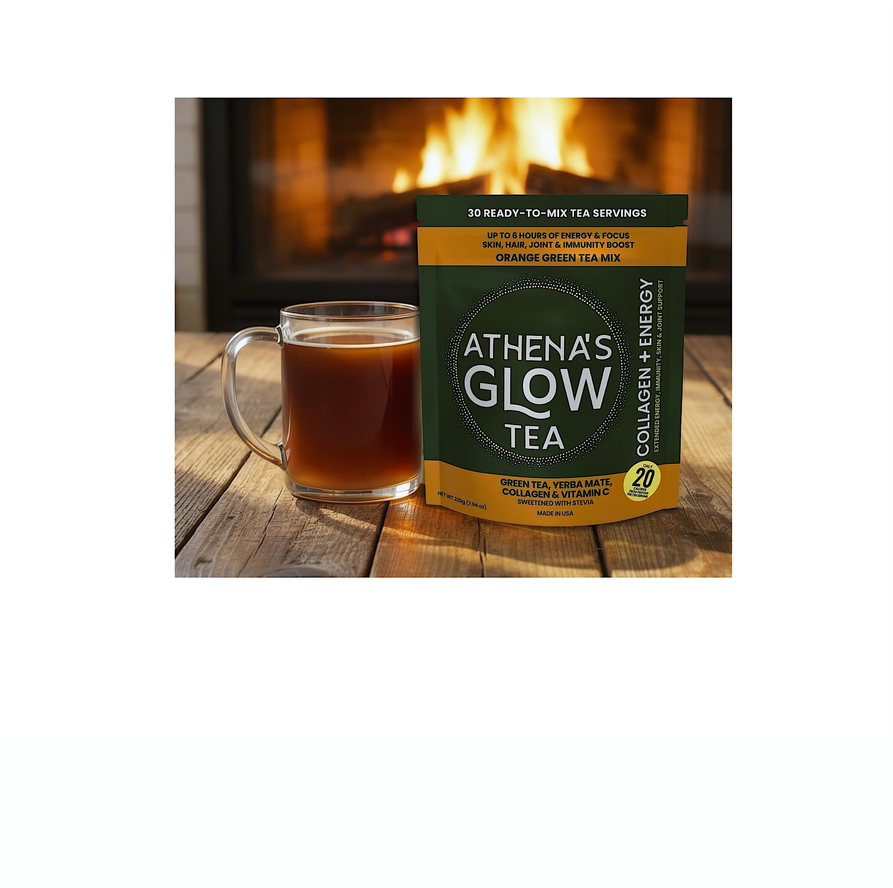 Athena's Glow Tea package with a mug of tea on a wooden surface in front of a fireplace.