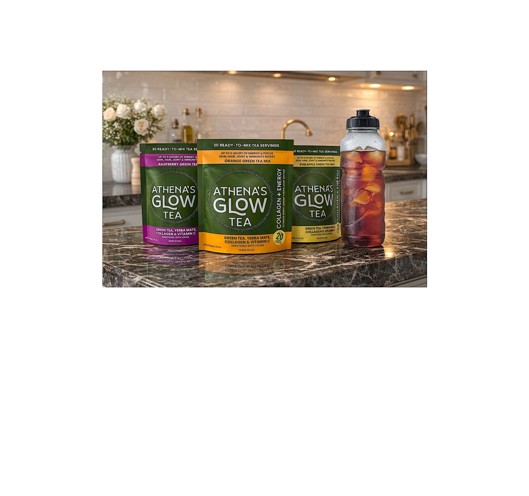  Athenas Glow Tea packages on a kitchen counter with a bottle of iced tea.