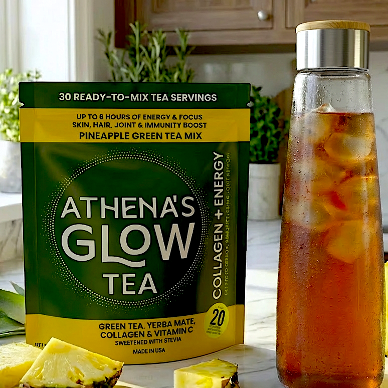 Athena's Glow Tea package with a glass bottle of iced tea and pineapple slices on a kitchen counter.