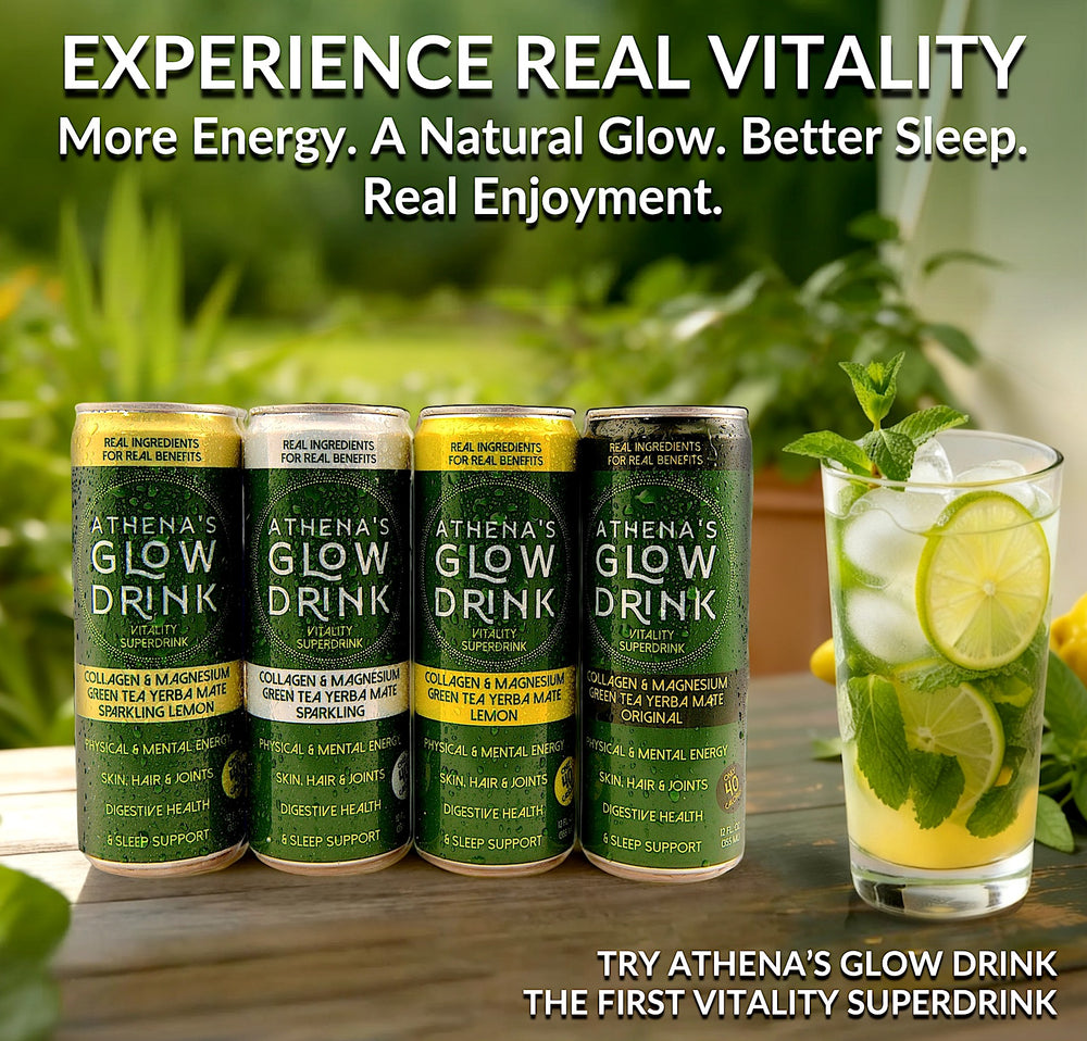 Athena's Glow Drink cans on a table with a glass of lemonade and lime garnish.