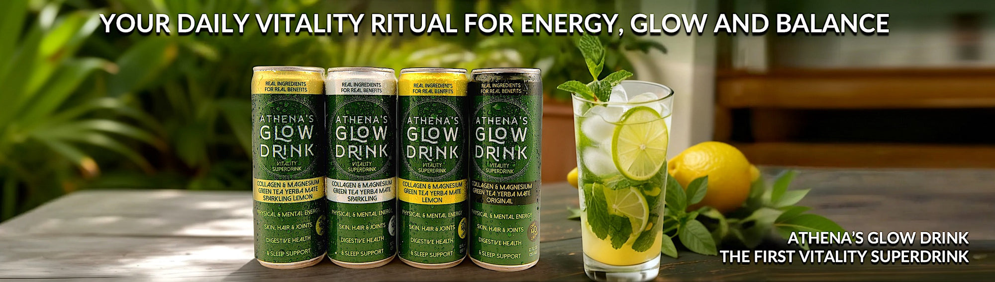 Athena's Glow Drink cans with a glass of a mocktail garnished with lime and lemon on a table.