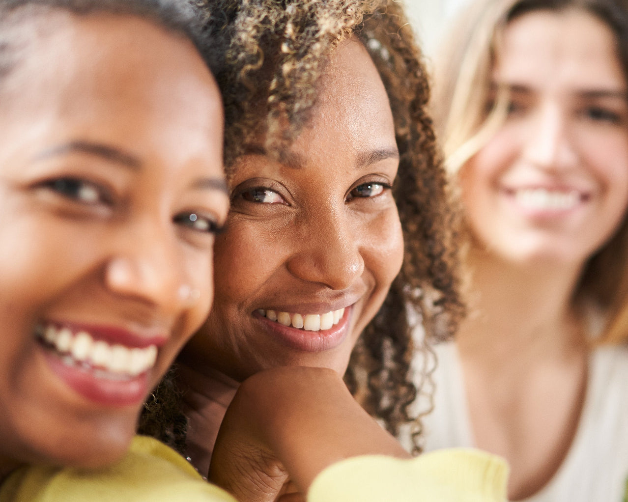 diverse women smiling together