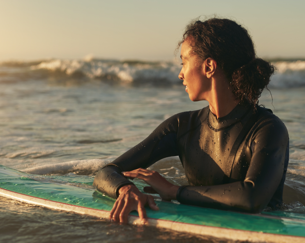 surfing woman in the ocean